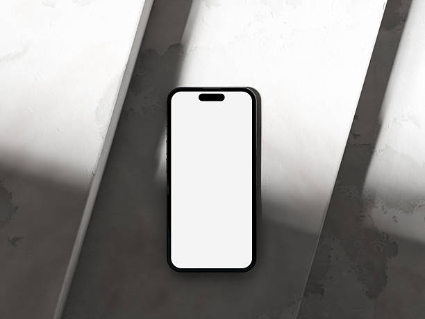 istock Modern phone mockup on a cement surface with a soft gradient of shadows. 2232022620