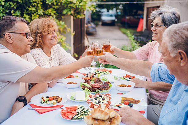 istock Senior friends enjoy in dinner 2232025692
