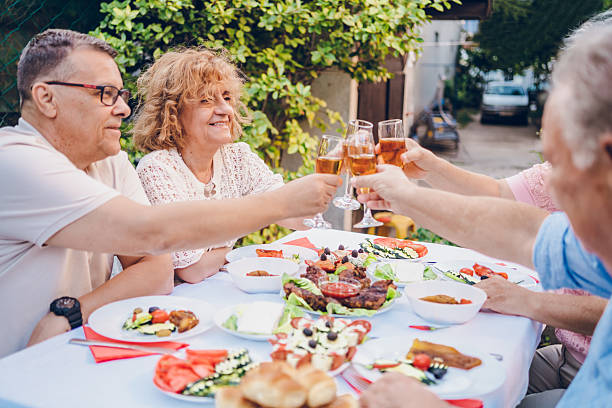 istock Senior friends enjoy in dinner 2232025861