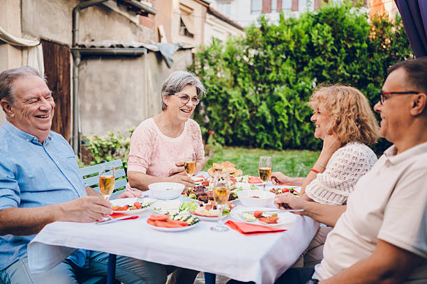 istock Senior friends enjoy in dinner 2232028699