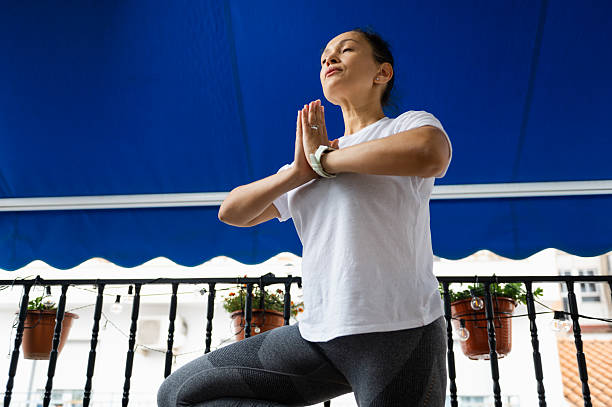 istock Woman Practicing Yoga Outdoors in a Calm and Peaceful Setting 2232030241