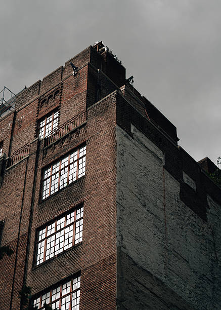 istock A brick building with a white roof and windows 2232030629