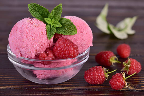 istock Homemade raspberry ice cream in a glass bowl. Close-up. 2232033372