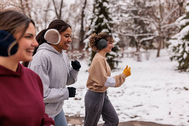 istock Women jogging outdoors on chilly winter morning 2232034081