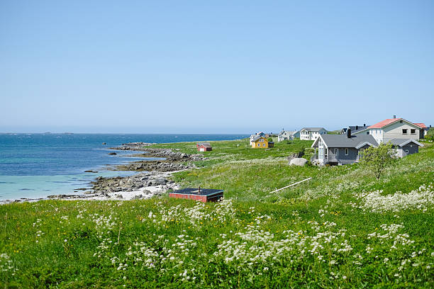 View across beach, sea and village, Haukland Beach, Lofoten, Vesteral Islands