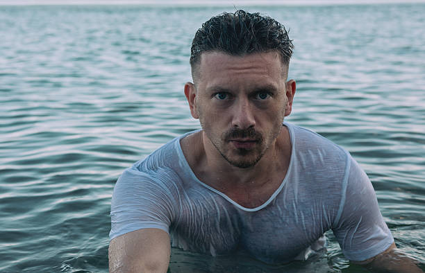 A man splashing in the ocean