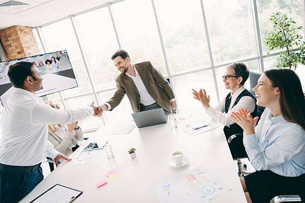 istock Professional team collaborating in a modern office environment during a productive meeting and handshake interaction 2232058474