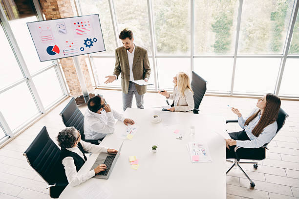 istock Diverse Team Discussing Strategy During a Corporate Meeting in a Modern Office Setting With Large Windows 2232058645