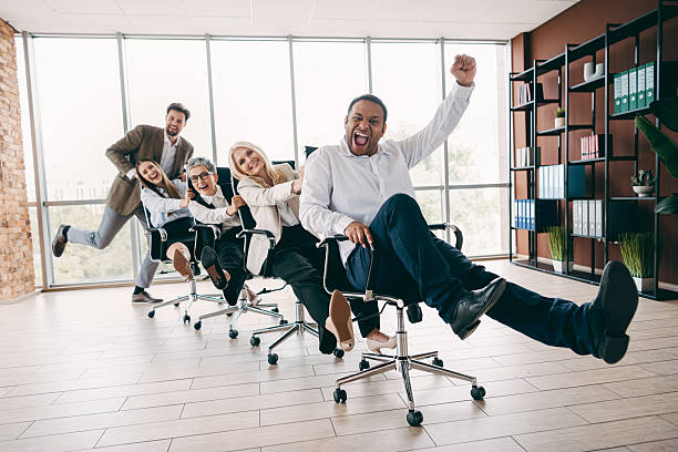 istock Energetic office team celebrating collaboration through fun and teamwork in a modern corporate environment indoors 2232058866