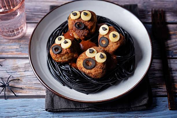istock Meatballs with black pasta in the plate for Halloween 2232059068