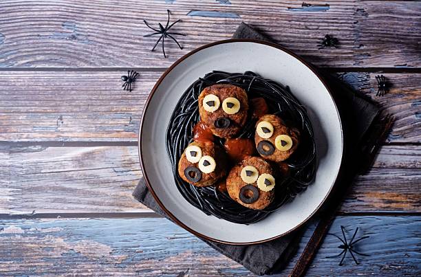 istock Meatballs with black pasta in the plate for Halloween 2232059083