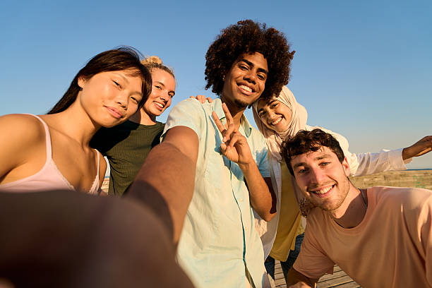 istock Happy young people taking selfie at the beach 2232064340