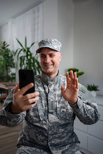 istock Smiling soldier making a video call with his family 2232070504