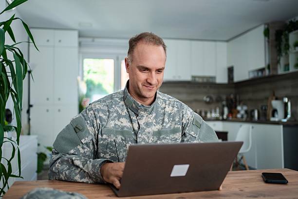 istock American Soldier Working From Home on Laptop 2232070541