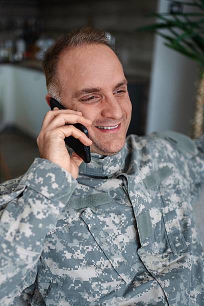 istock Happy military man talking on a smartphone 2232070595
