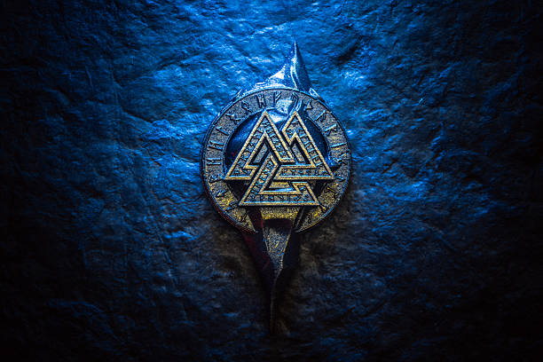 istock Valknut Rune Ancient Nordic Symbol on dark stone background 2232071547
