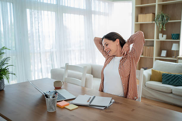 istock Businesswoman stretching while working from home office 2232071935