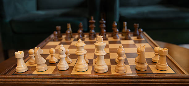 istock A view of chess pieces arranged on a chessboard in a moody scene. 2232073140