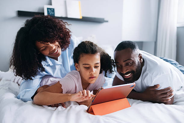 istock Family Spending Quality Time Together Exploring a Tablet Device 2232075964