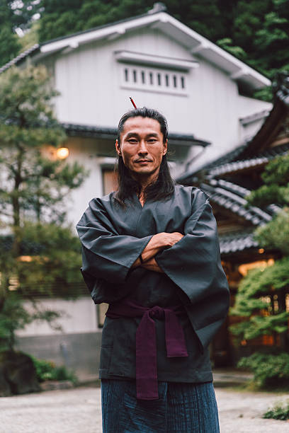 istock Japanese man in front of his home 2232079588