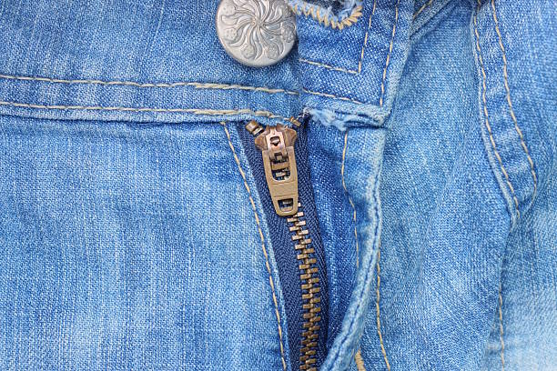 istock closed metal zip and with an iron grey button on blue cotton jeans 2232081226