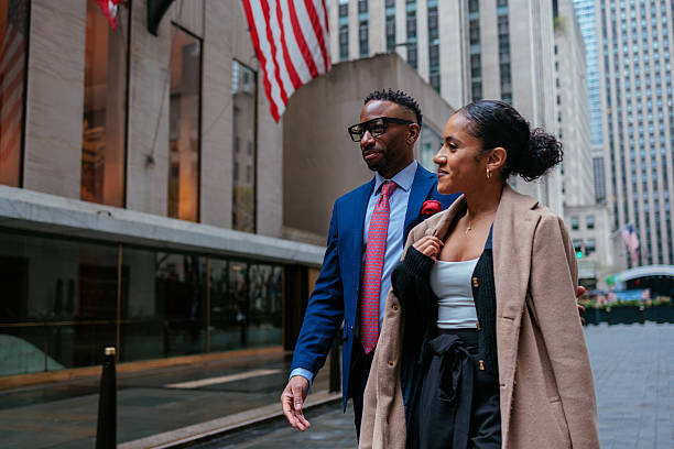 istock Couple walking and discussing in urban setting 2232084649