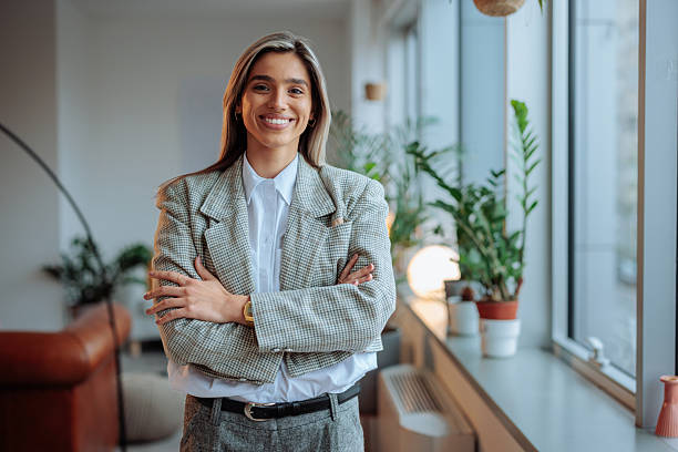 istock Blonde woman smiling and posing at work 2232084753