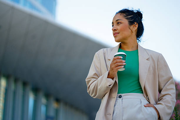 istock Professional woman enjoying morning coffee, gazing confidently ahead with optimistic workplace spirit 2232088538
