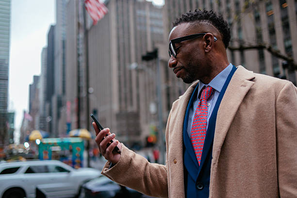 istock Man checks phone in urban NYC 2232090313