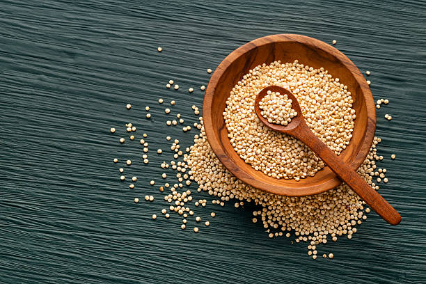 istock Raw organic quinoa seeds in a bowl and spoon - Chenopodium quinoa 2232107311