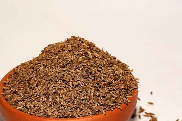 istock Organic Cumin Seeds Jeera in Bowl on White Background 2232112099