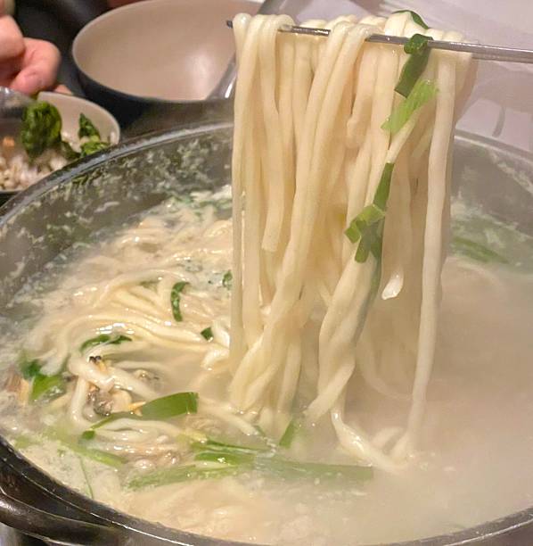 Warm and comforting kalguksu with hand-cut noodles in rich, savory broth, served with vegetables and sometimes seafood or chickenoffering a perfect bowl of hearty flavor and soothing texture in every bite.
