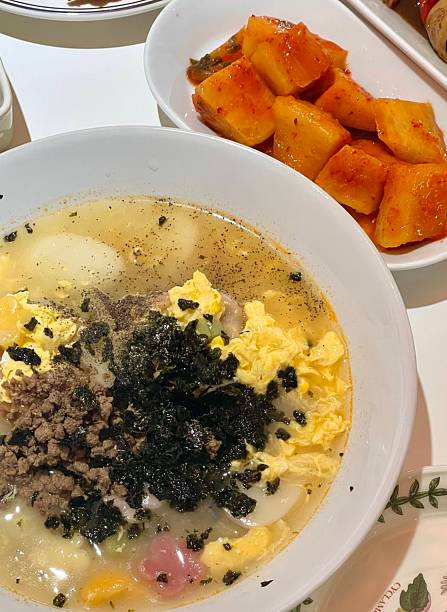 Warm and comforting kalguksu with hand-cut noodles in rich, savory broth, served with vegetables and sometimes seafood or chickenoffering a perfect bowl of hearty flavor and soothing texture in every bite.