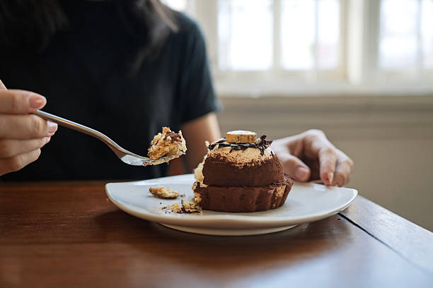 Person enjoying chocolate dessert with fork