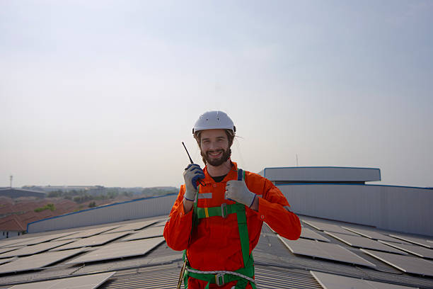istock Blue collar worker is inspecting solar panel at rooftop of factory. 2232115525