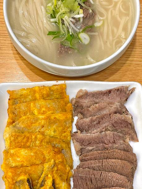 Warm and comforting kalguksu with hand-cut noodles in rich, savory broth, served with vegetables and sometimes seafood or chickenoffering a perfect bowl of hearty flavor and soothing texture in every bite.