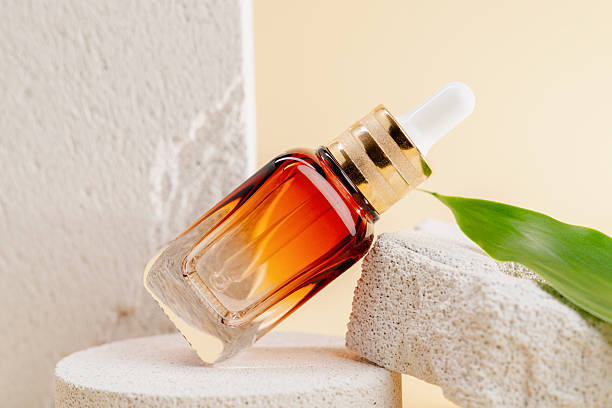 istock Cosmetic bottles on a stone podium, Blank label package for mock up on a beige background. The concept of natural beauty products. 2232117662