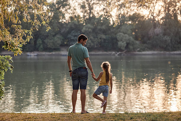 istock Father and daughter spending time in nature 2232119358