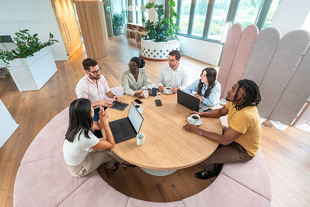 istock Diverse Business Executives Collaborating in Modern Energy-Efficient Office with Natural Light 2232122660