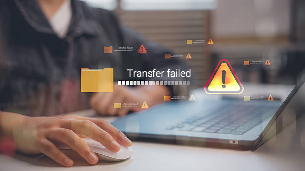 istock Digital error message transfer failed on laptop screen with warning icon. Concept of cyber security, data transfer problem, cloud storage issue, backup error, and technology risk. 2232124760