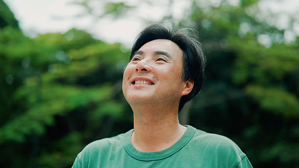 istock Middle-aged Asian man taking in fresh air while exercising in a park. 2232130502