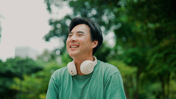 istock Middle-aged Asian man taking in fresh air while exercising in a park. 2232130549
