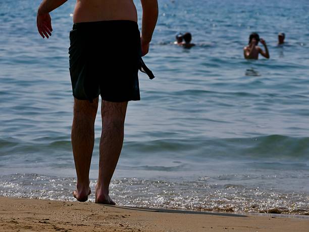 A person walking on the beach.