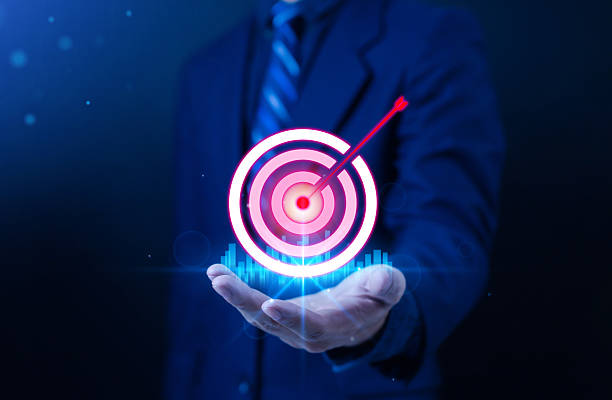 istock Businessman hand holding glowing target with arrow pointing towards the target which symbolizes success, business strategy, achieving digital marketing goals, leadership and financial growth concept. 2232135459