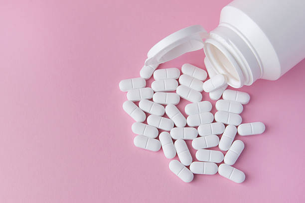 Woman taking vitamin pills