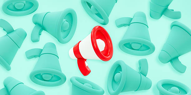 istock Red and white megaphone among group of blue megaphones on blue background 2232135987