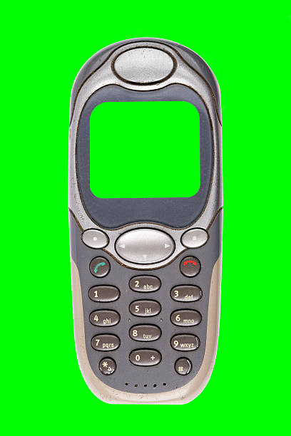 istock Classic mobile phone from the early 2000s with a green screen, isolated on a green background. 2232137515
