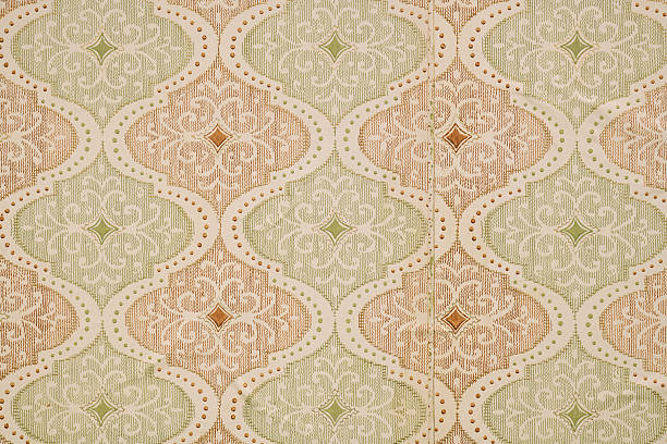 istock Old wallpaper on the wall. Old wallpaper for texture or background. 2232138243