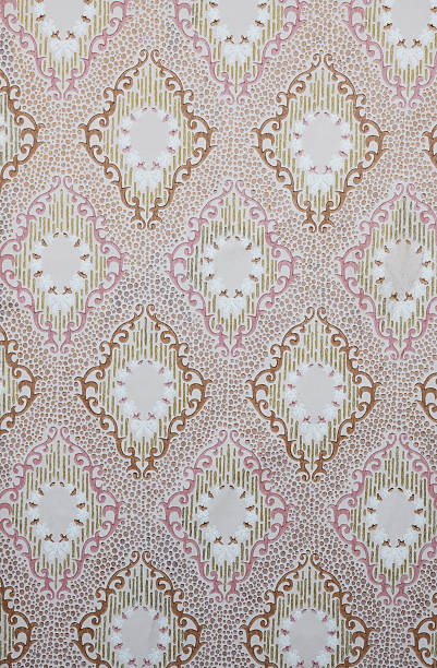 istock Old wallpaper on the wall. Old wallpaper for texture or background. 2232138296