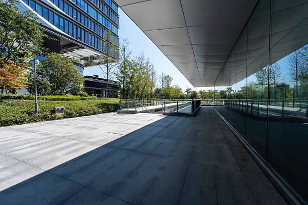 istock modern office building with street in city 2232138651